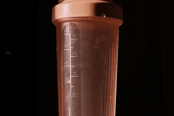 a blender bottle sitting on top of a counter