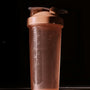 a blender bottle sitting on top of a counter