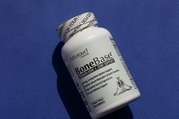 A close up of a pill bottle on a blue surface