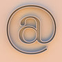 An at symbol on a beige background.